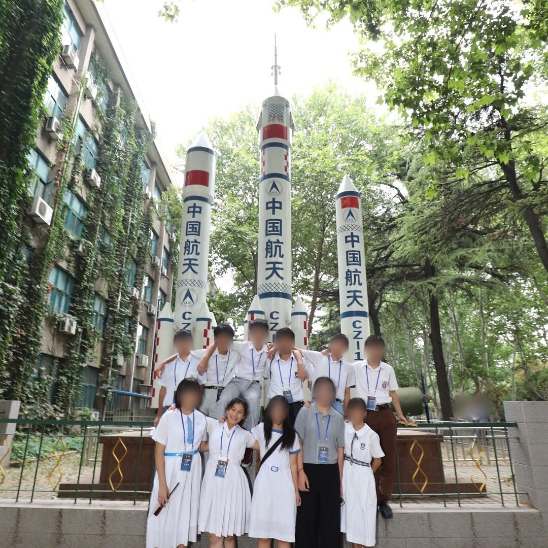 Student delegation in front of Long March launch vehicles, China Aerospace exploration trip 2017