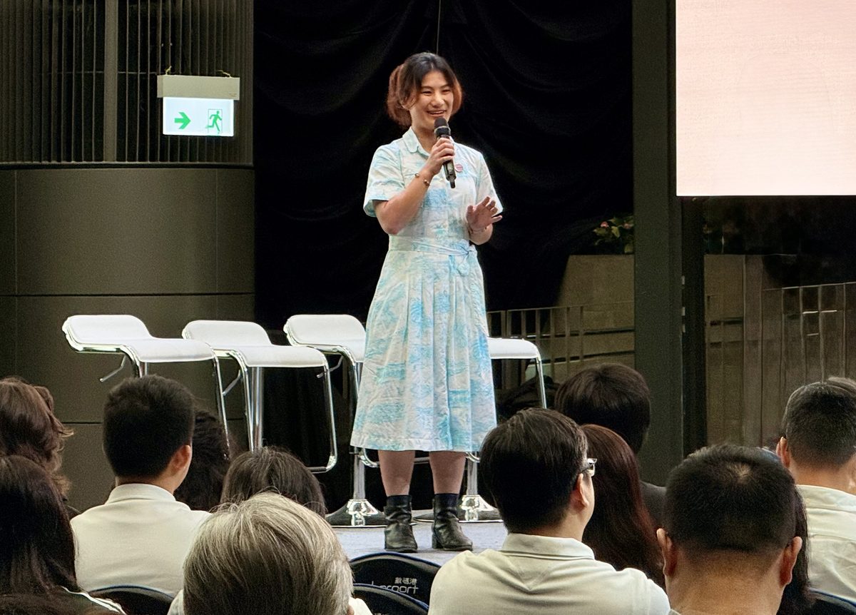 Rhea Lau speaking on stage at Cyberport, Hong Kong